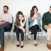 Bored applicants waiting for interview during recruitment at office